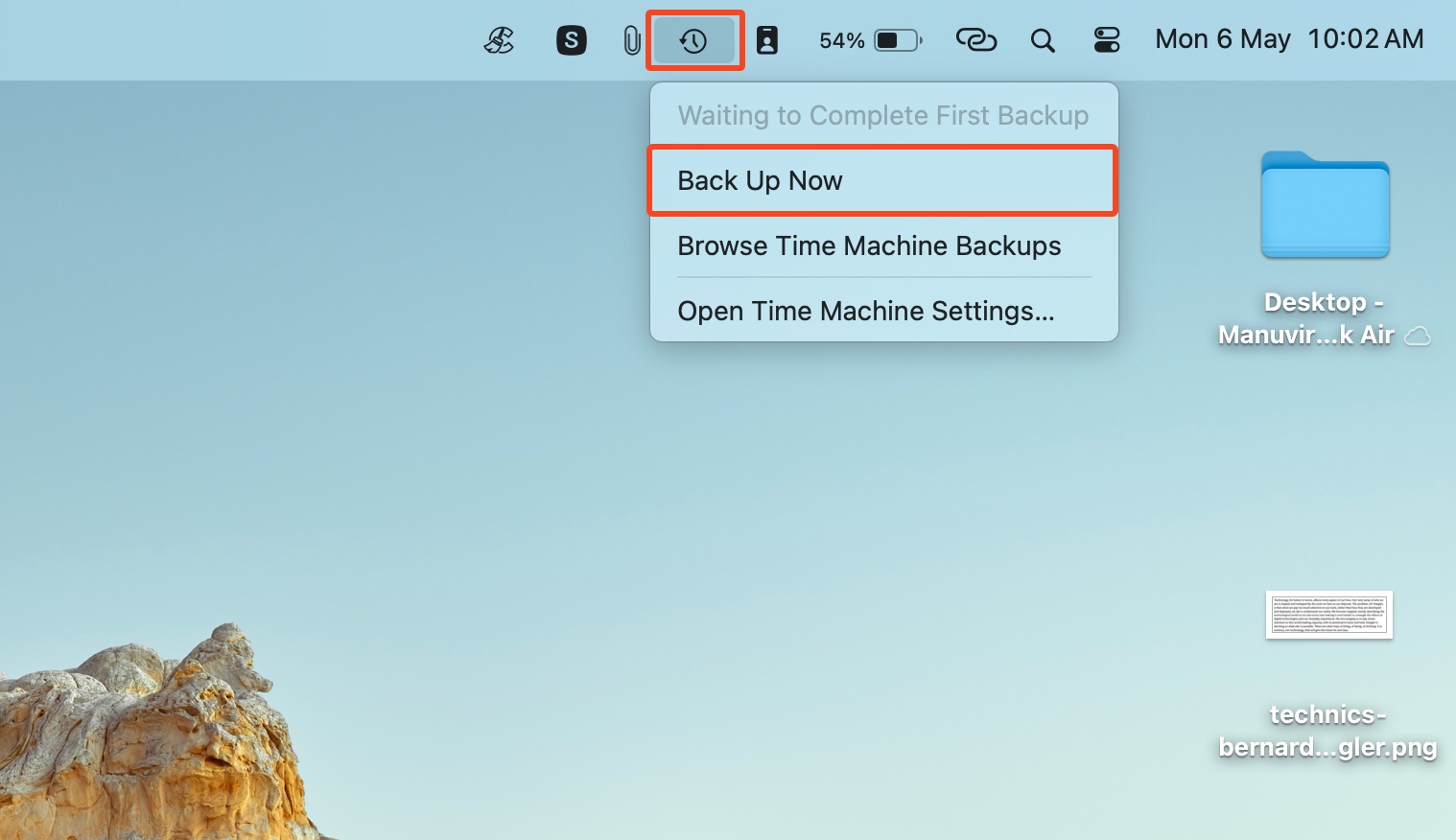 Time Machine icon clicked in the macOS menu bar, showing dropdown options including "Back Up Now" and "Browse Time Machine Backups."